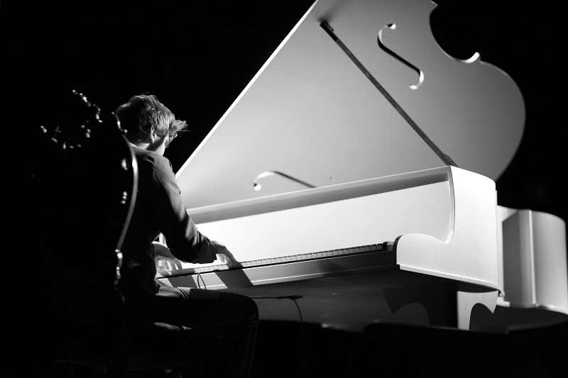 musician playing the grand piano