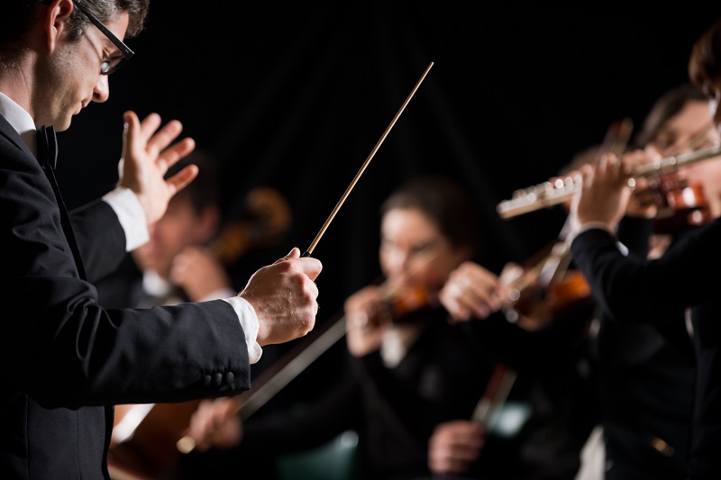 Conductor directing symphony orchestra