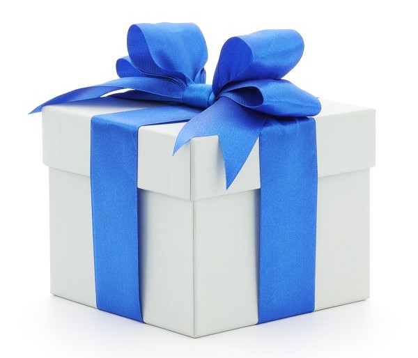 White gift box with blue bow on white background